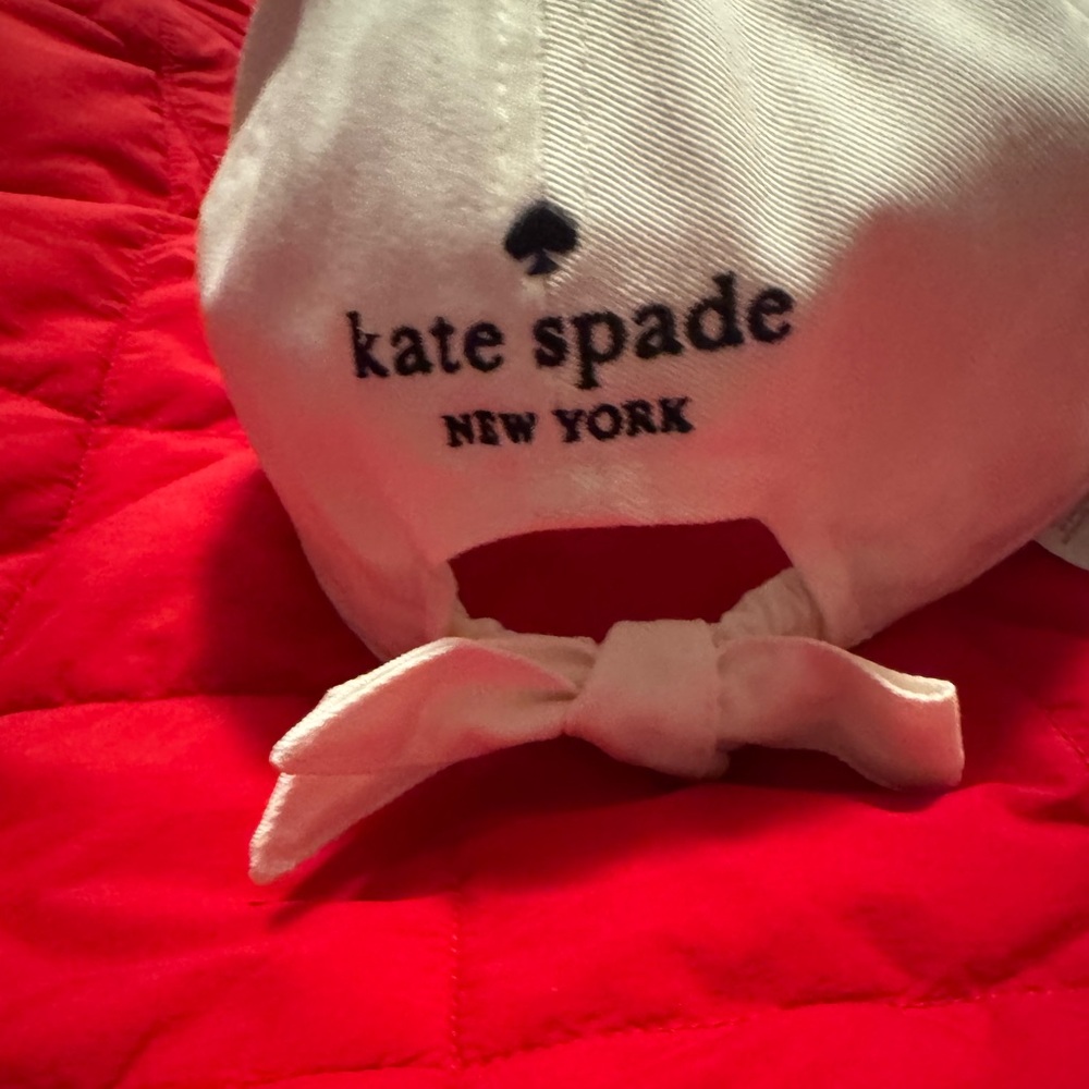 Kate Spade winter White Cap w/ Bow, black wording,iconic ♠️in gold!cute& classy